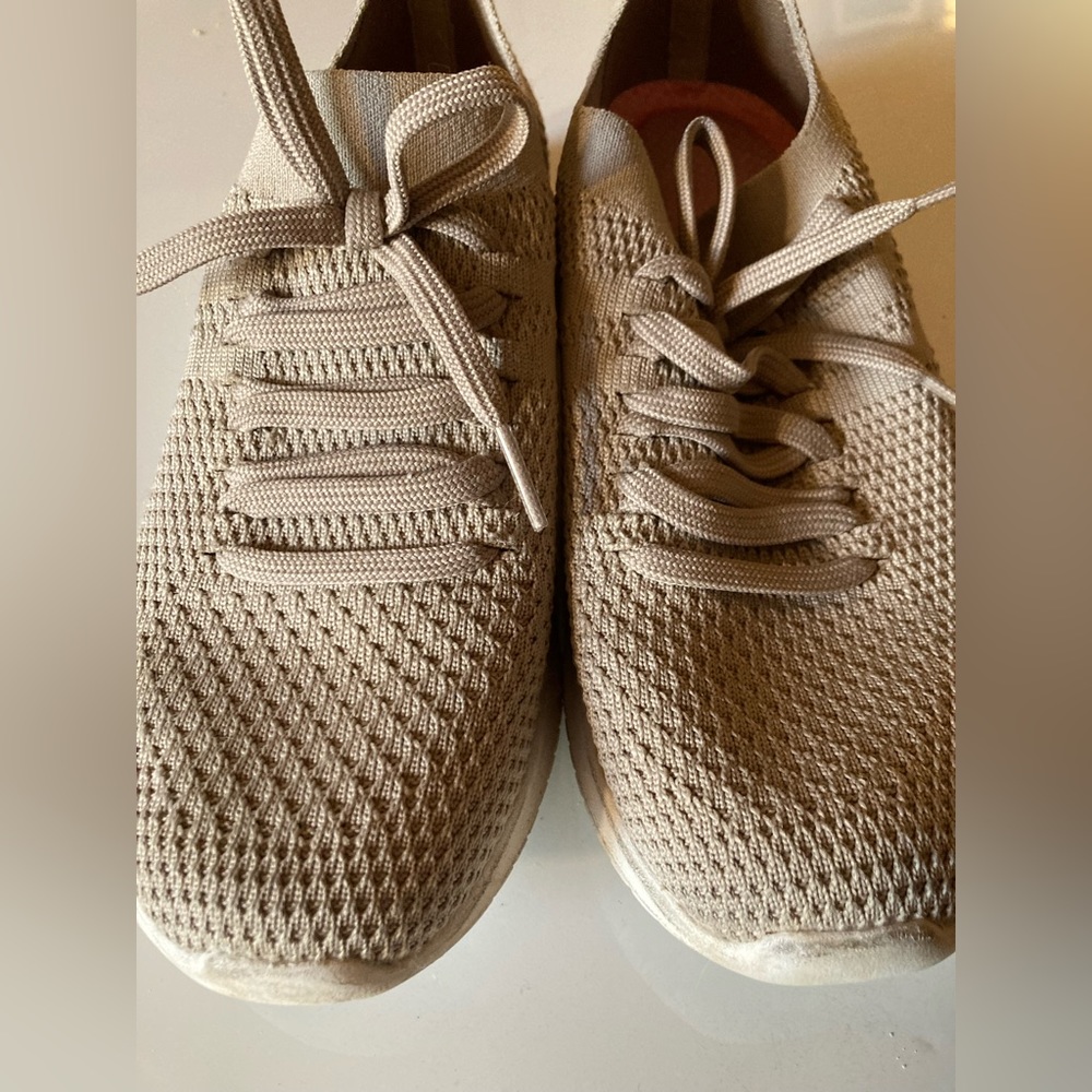 Beige women’s Skechers.